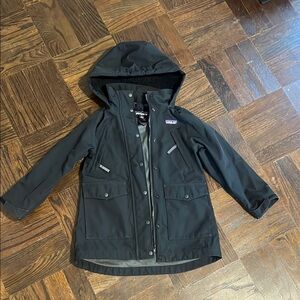 Patagonia Black Raincoat with Hood and Weather-Resistant Fabric